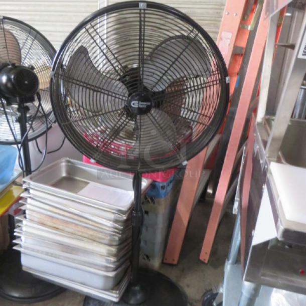 Commercial Electric Stand Fan, adjustable height, metal blades, black finish, sturdy base, used condition.