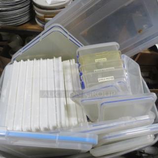 A collection of plasticware containers with blue lids, various sizes. Labels include "Turbinado" and "Apple Pectin". Used condition.