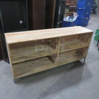 Wooden and metal shelving unit, 64"x16"x29", featuring four spacious shelves in good condition, ideal for storage.