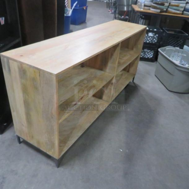 Wooden and metal shelving unit, 64x16x29 inches, with 4 shelves. Modern design, sturdy condition. Ideal for storage.