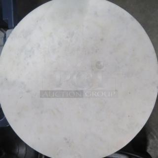 Small round table with marble top and metal base, 10x22.5 inches. Marble is chipped.