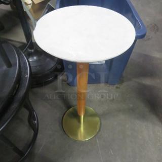 Round table with marble top and metal base, 10x22.5. Marble is chipped.