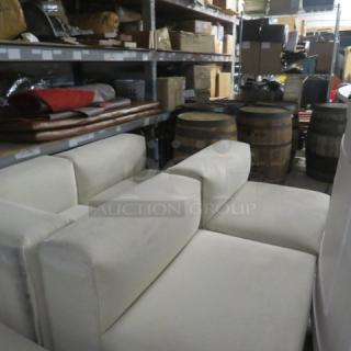 White 6-piece overstuffed sectional couch, very large and heavy sections, displayed in storage setting.