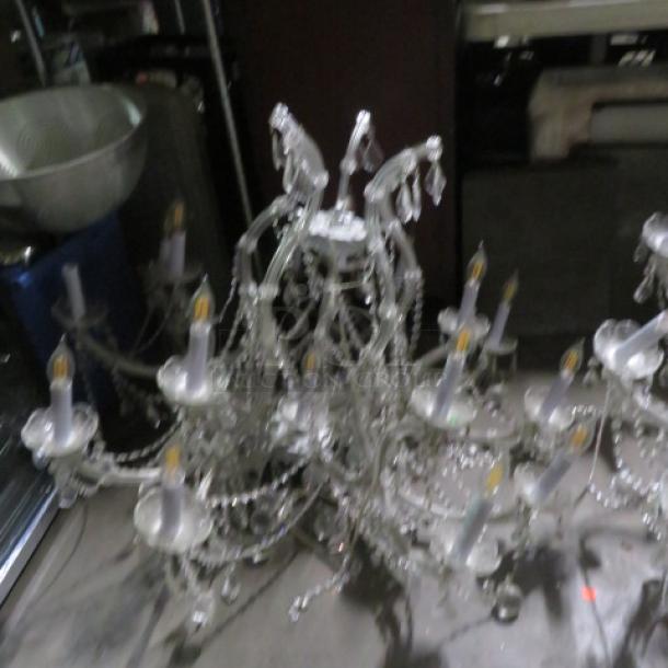 Elegant 16-light crystal chandelier, intricately designed with hanging crystal beads; good condition, ideal for grand settings.