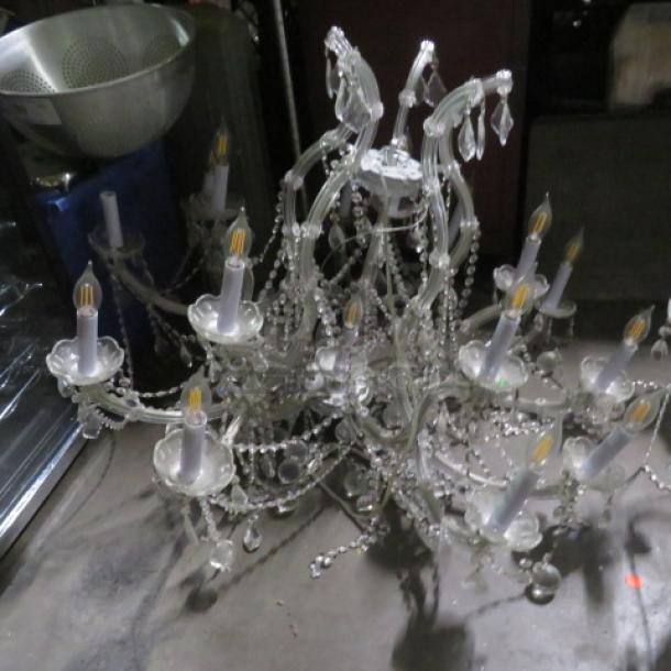 Beautiful crystal chandelier with 16 lights, ornate design, excellent condition, featuring hanging crystal accents.