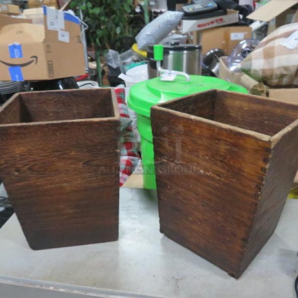 Pair of wooden planters, 9x9x12 inches, rustic finish, square shape, visible grain, suitable for indoor or outdoor use.