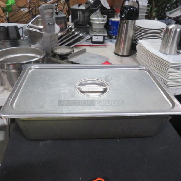 Stainless steel 6-inch deep hotel pan with lid, full size. Features rounded handles; pre-owned, in good condition.