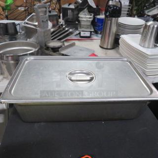 Stainless steel 6-inch deep hotel pan with lid, full size. Features rounded handles; pre-owned, in good condition.