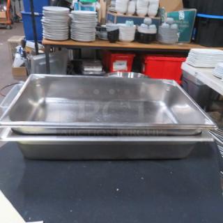 Full-size 4-inch deep hotel pan, stainless steel, used condition, ideal for professional kitchen use, with two pans visible.