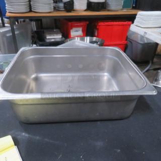 Stainless steel half-size hotel pan, 4-inch deep, used condition. Suitable for commercial kitchen use.