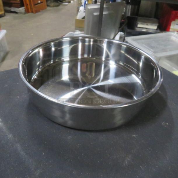 Stainless steel bowl, new, 8.5"x2", shiny finish, smooth surface, ideal for kitchen use.