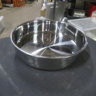 Stainless steel bowl, new, 8.5"x2", shiny finish, smooth surface, ideal for kitchen use.