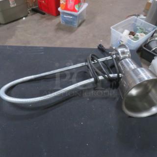 Adjustable stainless steel warmer light, used condition, flexible neck, with power cord. Ideal for commercial kitchens.