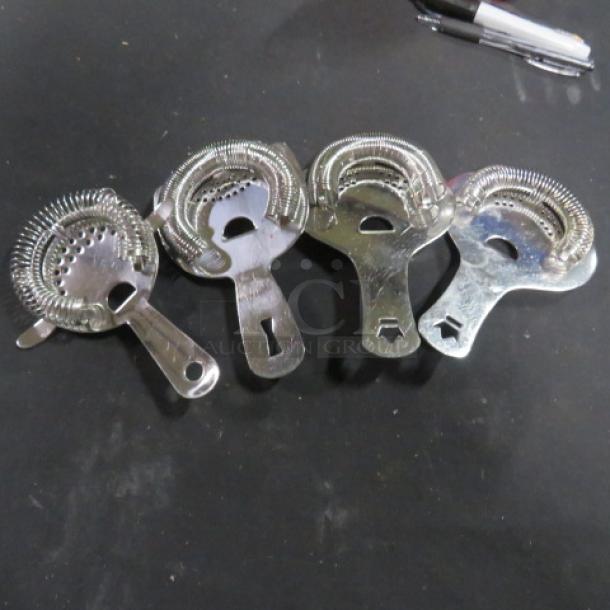 Assorted bar strainers, set of four, metallic finish, spiral coil design, gently used condition.