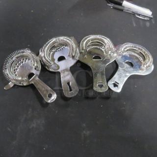 Assorted bar strainers, set of four, metallic finish, spiral coil design, gently used condition.