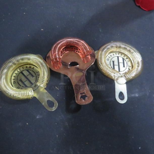 Assorted bar strainers set, featuring gold and copper finishes, branded with "DIRITEKA." Three strainers in good condition.