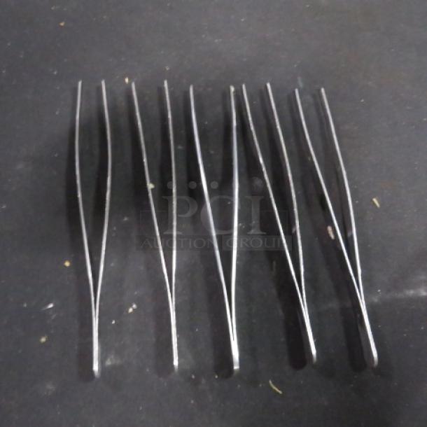 Set of six stainless steel bar tongs. Model 5XBID. Used condition, suitable for bar or culinary use.