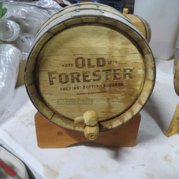 Old Forester wooden whiskey barrel on a stand, featuring established branding. Appears in good condition.