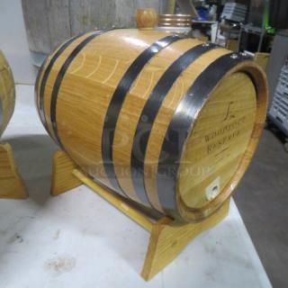 Woodford Reserve wooden whiskey barrel on a stand, featuring black metal bands and branded markings, in excellent condition.