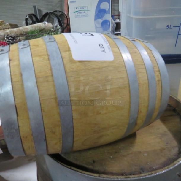 Woodford Reserve wooden whiskey barrel with metal bands, in good condition, used for aging bourbon.