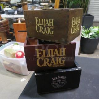 Assorted wooden bar organizers, featuring Elijah Craig and Jack Daniel's branding, in used condition. Perfect for bars.