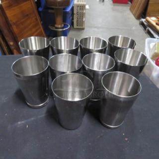 Set of 10 stainless steel mixing glasses, polished finish, excellent condition, ideal for bar or kitchen use.