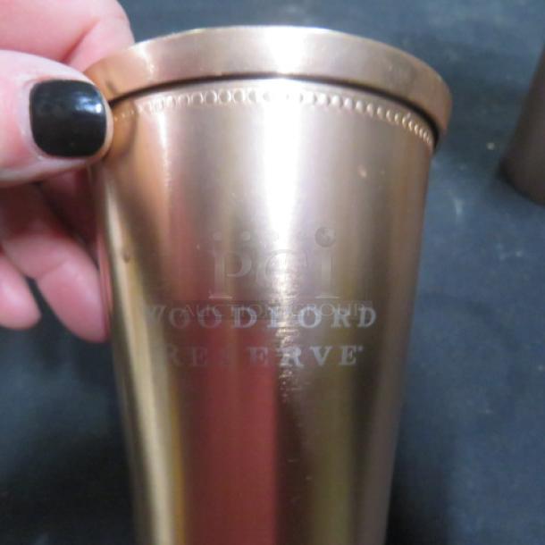 Woodford Reserve copper mule cup, polished finish, engraved logo, excellent condition, collectible item.