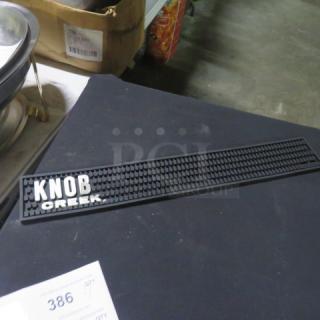 NEW Knob Creek bar mat, black rubber, features "KNOB CREEK" logo in white. Excellent condition. Item tag 386 visible.