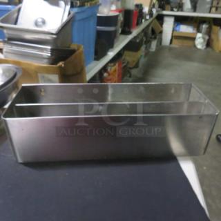 Stainless steel dual bottle rail, 23.5x8x6 inches, in good condition. Ideal for bar storage or organization.