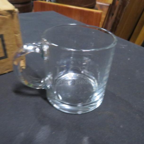 NEW Libbey 7oz glass mug with handle, in pristine condition. Transparent and ideal for hot beverages. Model 12XBID.