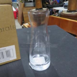 New Acopia 6oz Glass Carafe, clear glass, sleek design, includes box with barcode; model 6XBID.
