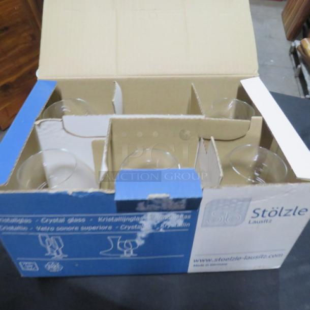 New Stolzle brandy glasses in original box, set of 6. Box displays Stolzle Lausitz branding and product details.