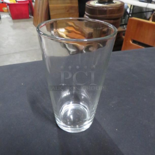New 16oz clear beer/water glass, cylindrical design, excellent condition, perfect for beverages.