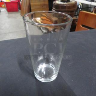 New 16oz clear beer/water glass, cylindrical design, excellent condition, perfect for beverages.