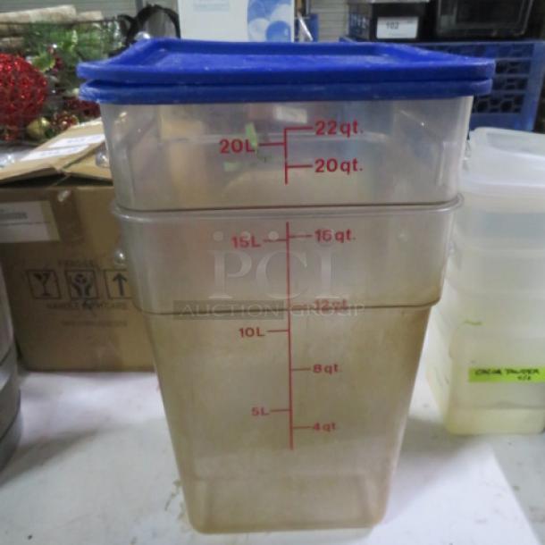 22qt food storage container with blue lid, clear body, marked with measurement scales. Used condition, model 2XBID.