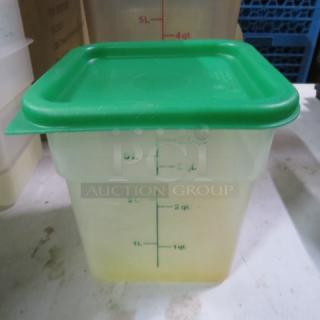 4qt food storage container with green lid, measuring markings visible. Condition appears used. Model 5XBID.