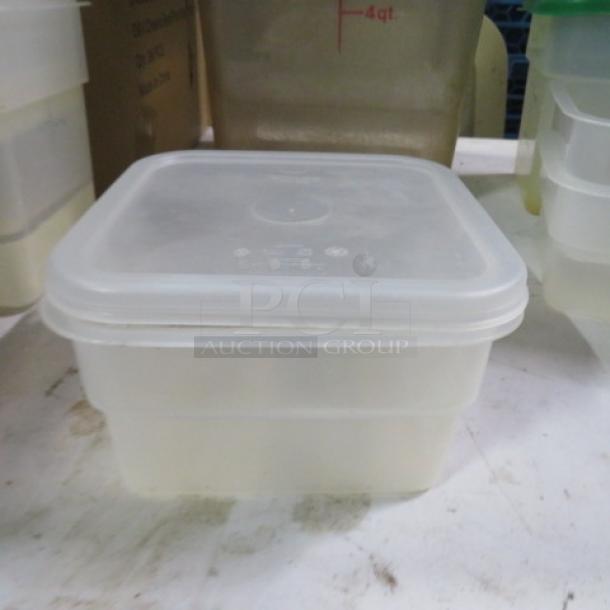 Clear 2qt food storage container with lid, square shape, durable plastic, stackable design, ideal for kitchen use.