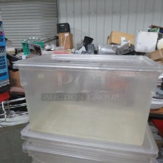 22-gallon clear plastic food storage container with lid, used condition, ideal for bulk food storage.