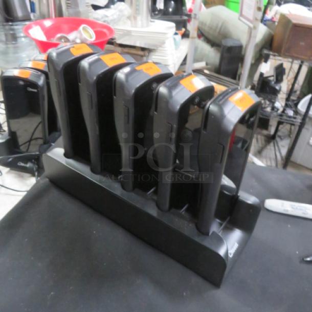 One Lot Of Toast GO 1 POS handheld terminals with charging station, model TG100, set of six, used condition.