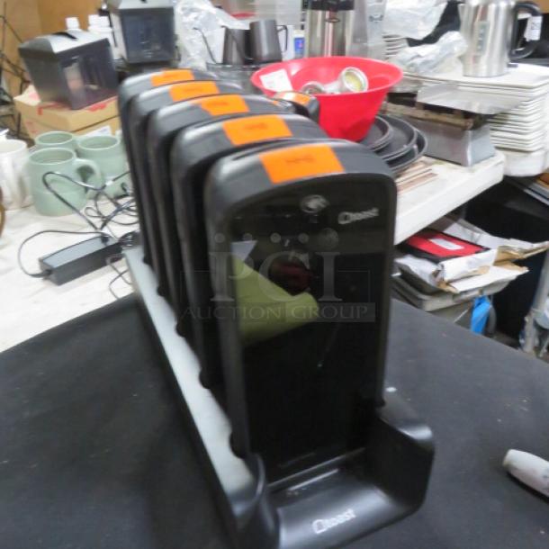 One Lot Of Toast GO 1 POS Handheld Terminal Model TG100 with Charging Station. Includes six devices.