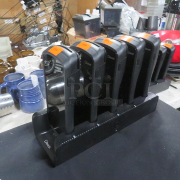 Toast GO 1 POS handheld terminal set with charging station, model TG100. Includes six units. Good condition.