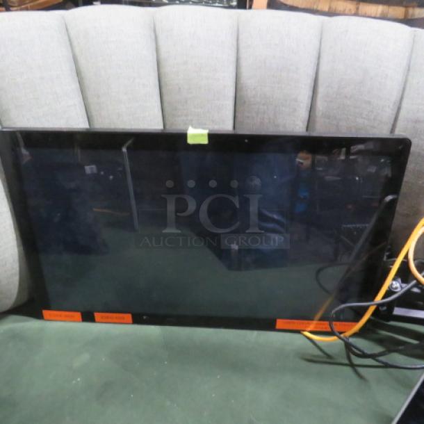 One Toast Flex 22 Monitor, black frame, flat panel, good condition, visible cables, green tape label, orange stickers on front.
