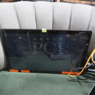 One Toast Flex 22 Monitor, black frame, flat panel, good condition, visible cables, green tape label, orange stickers on front.