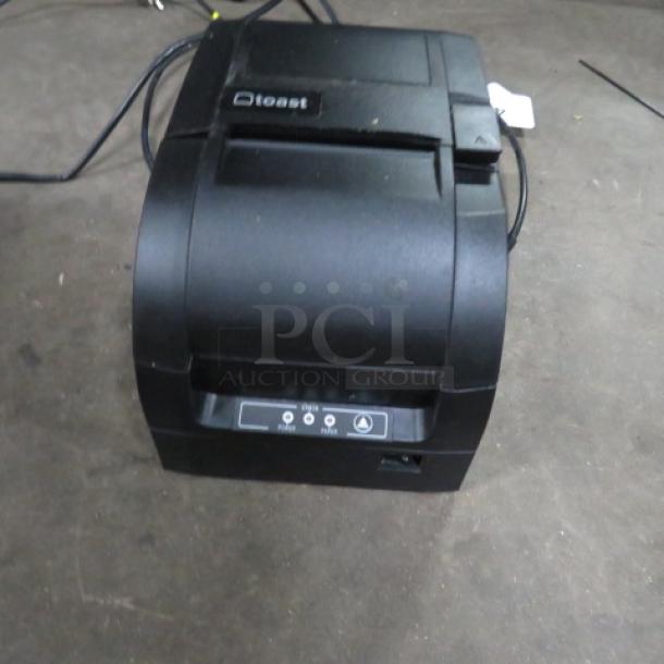 Toast TXP300 thermal printer in good condition, showing top labels and control panel.