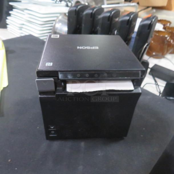 Epson M335B thermal printer in black, showing front paper feed. Good condition with minor wear, model label clearly visible.