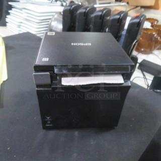 Epson M335B thermal printer in black, showing front paper feed. Good condition with minor wear, model label clearly visible.