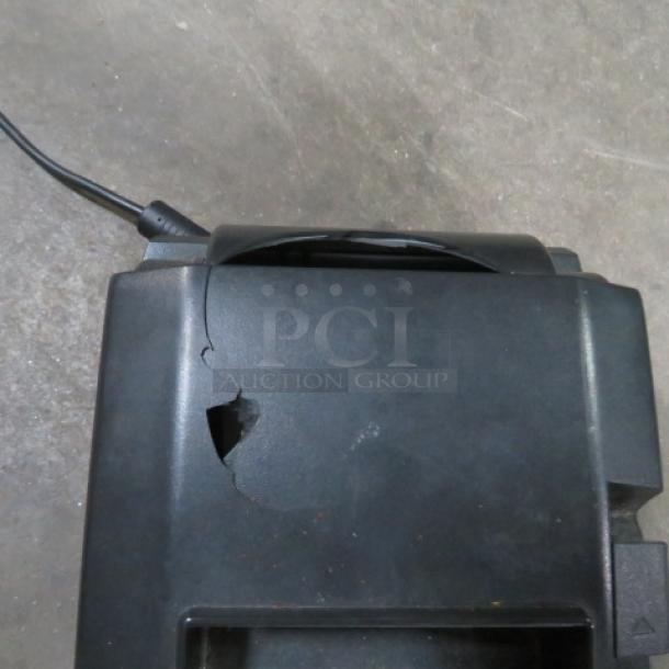 Star TSP650 thermal printer, black, visible hole on top, power cord attached, used condition.