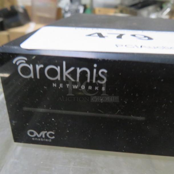 Araknis Gigabit Switch #AN-110-SW-R-16 with multiple ports, OvrC enabled, in good condition for networking solutions.