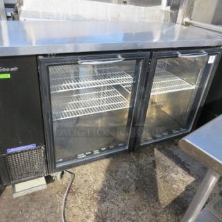 Turbo Air glass door back bar cooler, model TBB-24-60SGN, with 3 racks, on casters, in working condition. Dimensions 61x24x38.5.