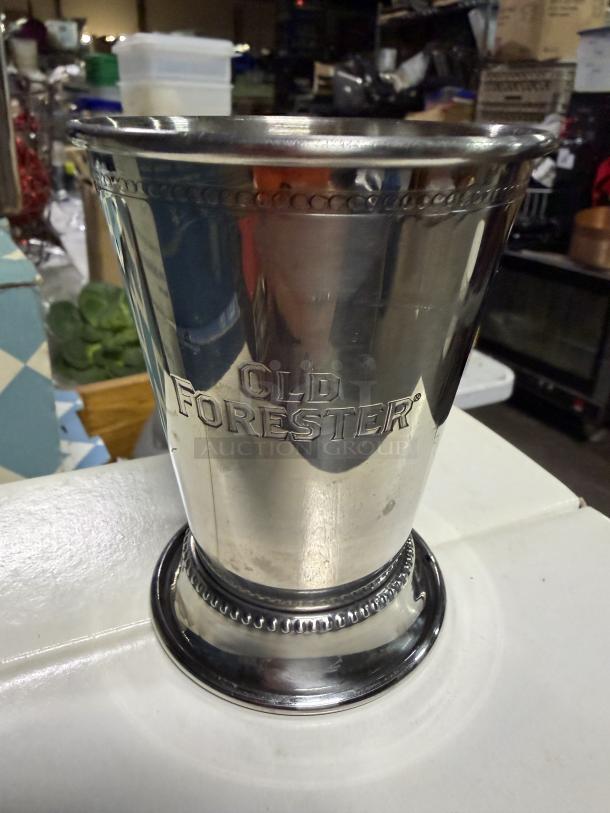 Old Forester stainless steel footed mule cup, engraved logo, excellent condition, ornate rim and base detailing.